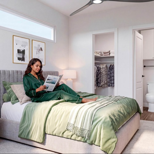 resident relaxes on her bed with a book